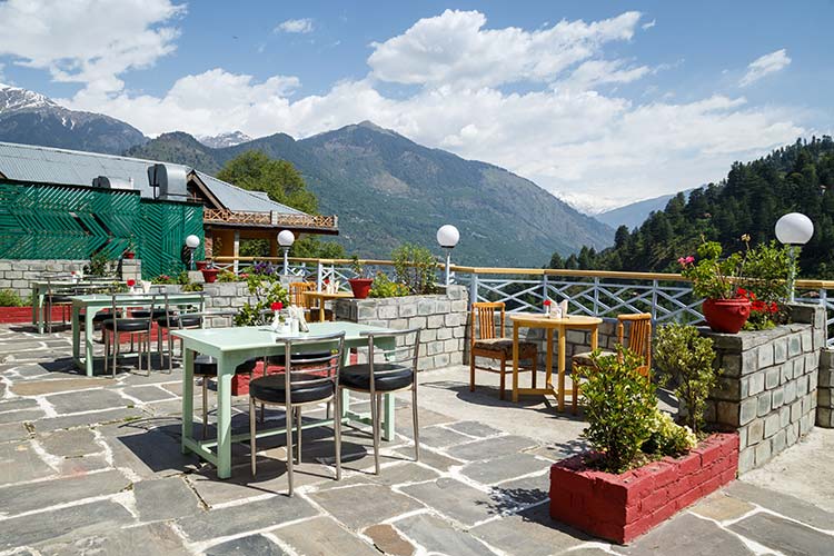 Rooftop restaurant at Naggar Delight and Himalayas view